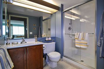 a bathroom with a toilet sink and shower